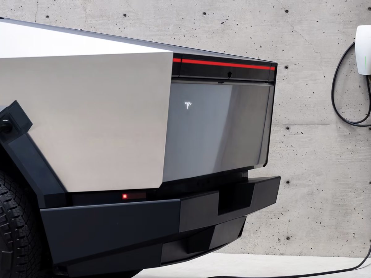 Tesla Cybertruck plugged into a Tesla Wall Connector